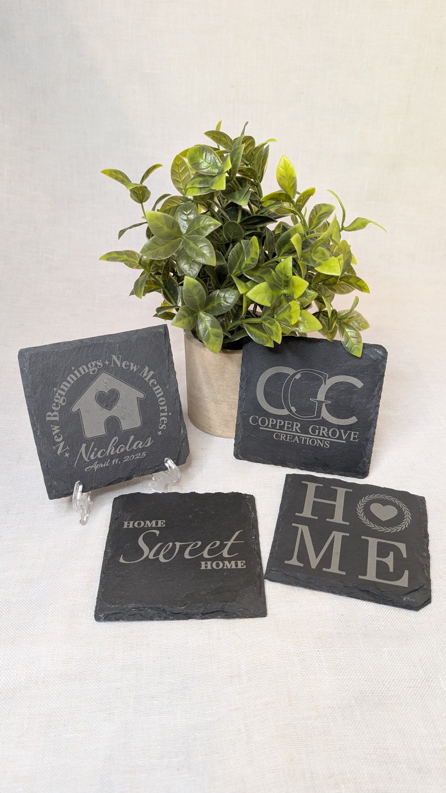 Set of four custom engraved slate coasters by Copper Grove Creations featuring personalized designs and home décor themes, perfect for housewarming gifts and everyday use.