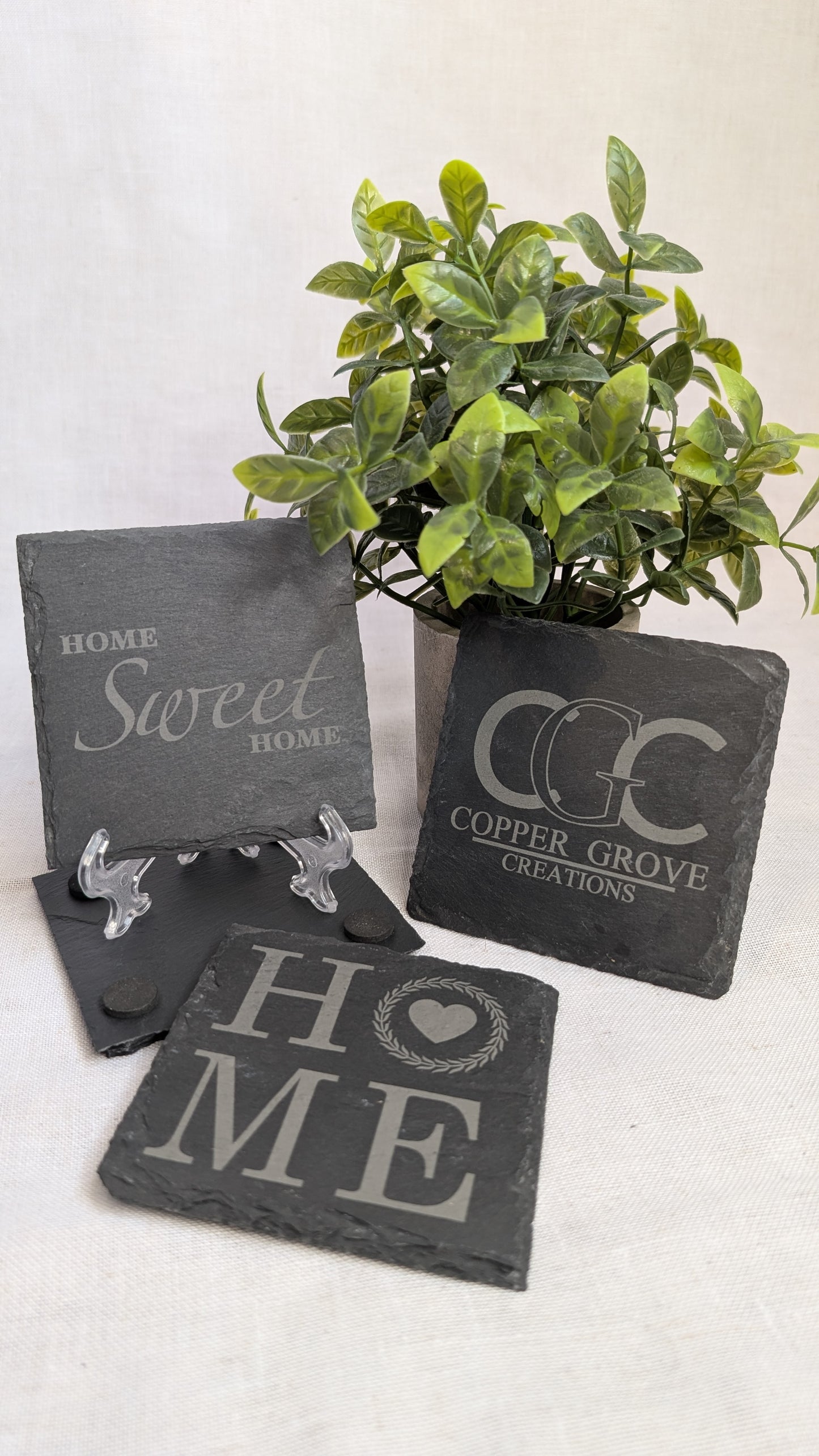Custom engraved slate coasters by Copper Grove Creations featuring home-inspired designs, perfect for personalized home décor and thoughtful housewarming gifts.