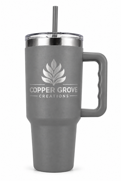 Gray Copper Grove Creations laser engraved insulated tumbler with handle and straw featuring a custom engraved logo design on a clean white background.