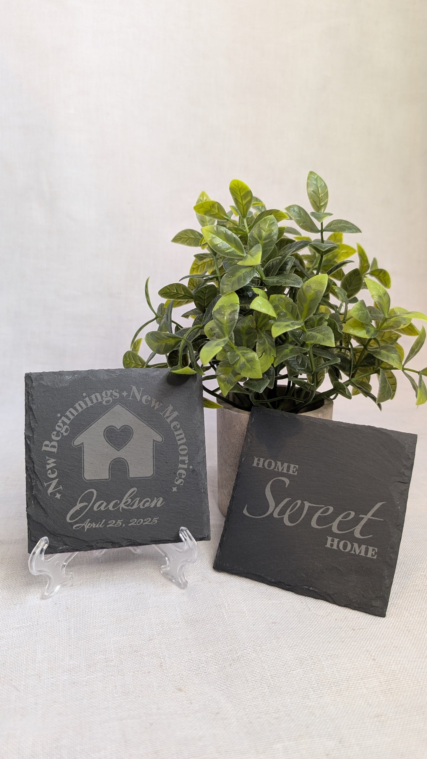Personalized slate coaster set by Copper Grove Creations featuring custom family name and home-themed engraved designs, perfect for housewarming gifts and everyday use.