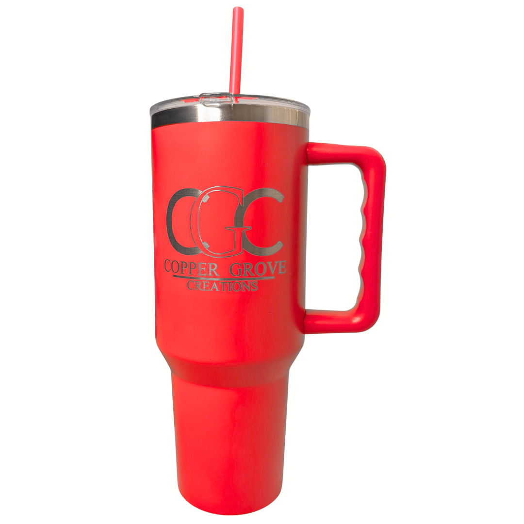 Red Copper Grove Creations laser engraved insulated tumbler with handle and straw featuring a custom engraved logo design on a clean white background.