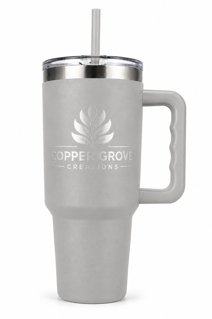 White Copper Grove Creations laser engraved insulated tumbler with handle and straw featuring a custom engraved logo design on a clean white background.