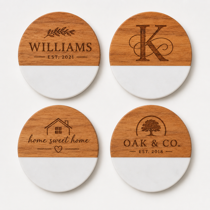 Set of four custom engraved round marble and acacia wood coasters featuring a family name, monogram, home design, and business logo.