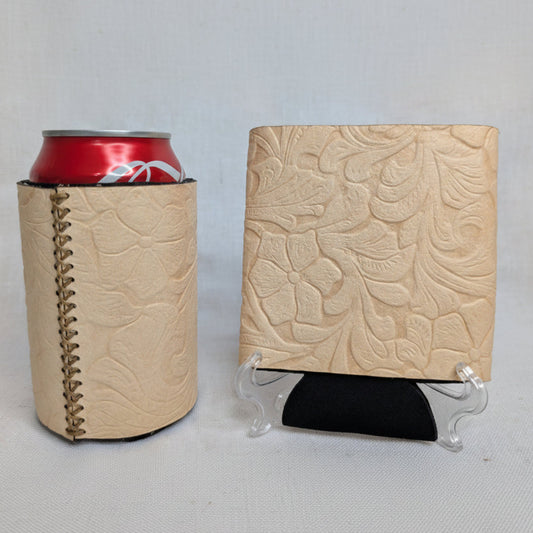 Beige embossed floral leather can cooler with visible side stitching displayed beside a matching leather sample.