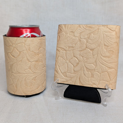 Natural leather can cooler and matching square sample featuring an embossed floral pattern on a light neutral background.
