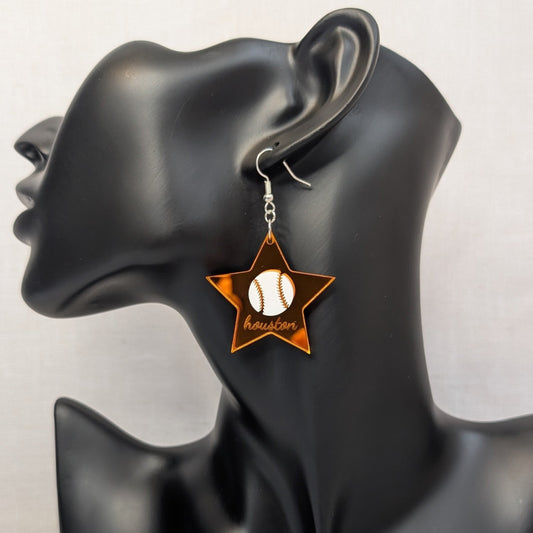 Orange Houston baseball star dangle earring with a white baseball design displayed on a black jewelry stand.