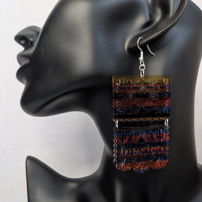 Colorful Serape Earrings Mexico dangle earring with floral, cactus, and Mexico details displayed on a black jewelry stand.