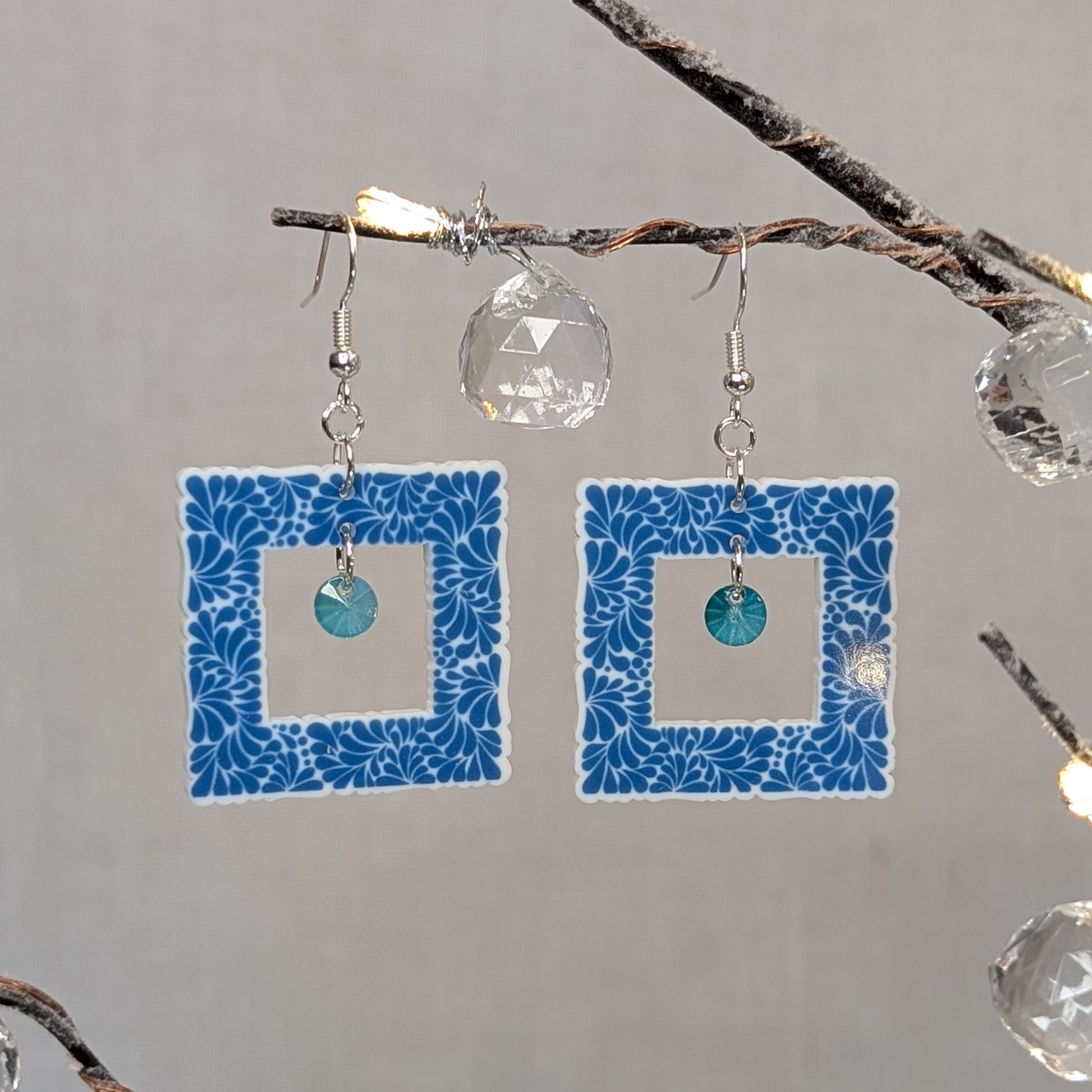 Aqua blue Talavera square earrings with white floral patterns and matching aqua crystal dangle charms.
