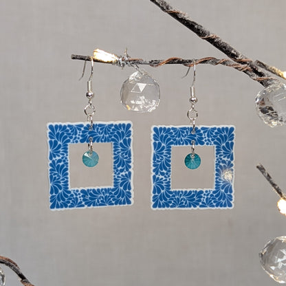 Aqua blue Talavera square earrings with white floral patterns and matching aqua crystal dangle charms.