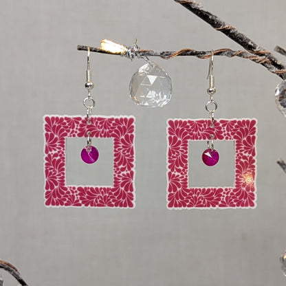 Pink Talavera square earrings with white floral patterns and matching pink crystal dangle charms.