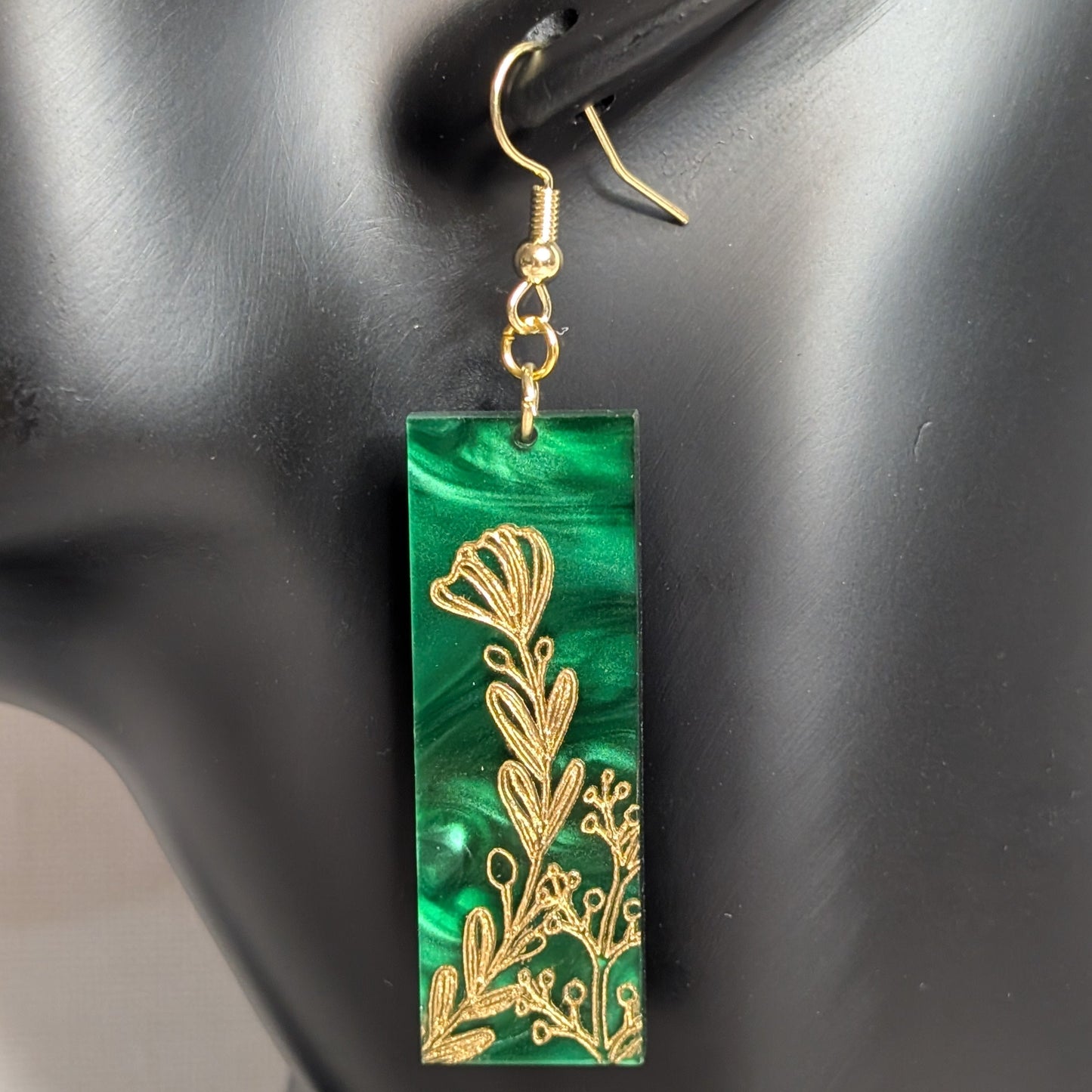Green marbled rectangular dangle earring from The Gilded Garden Collection with an intricate gold floral design.