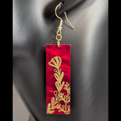 Red rectangular dangle earring from The Gilded Garden Collection featuring an intricate gold floral design.